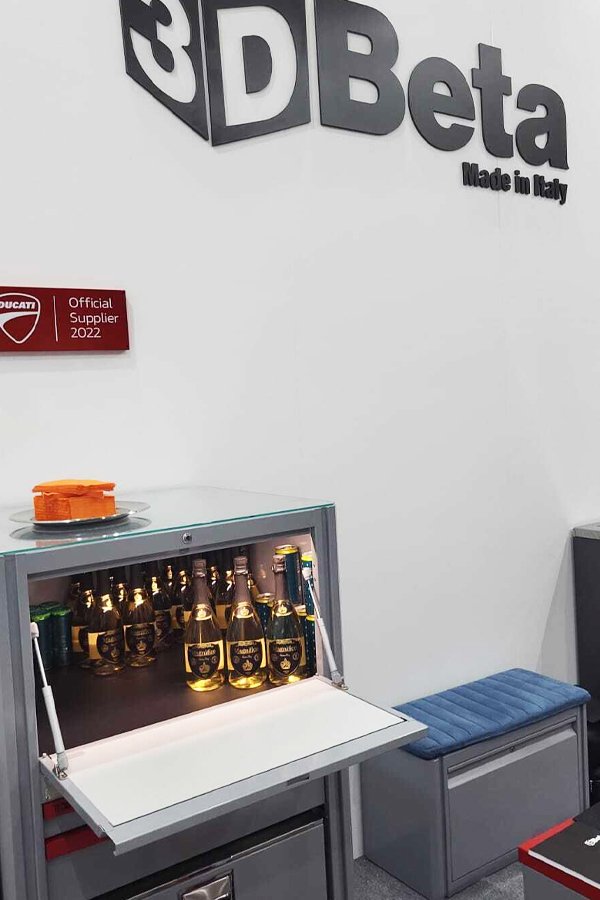 Workshop furniture display features 3D Beta sign and champagne cabinet at Eurobike 2023 edition event